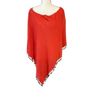 Vertigo Paris Vibrant Asymmetric Knit Poncho fringed with metal disks